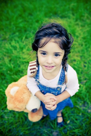 Young gorgeous girl with huge eyes looking into cameraの写真素材