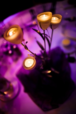 Romantic centerpiece with candles selective focusの写真素材