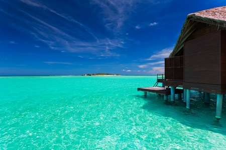 Over water bungalow with steps into amazing blue lagoonのeditorial素材