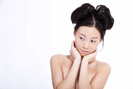 Sensual topless young asian woman isolated on whiteの写真素材