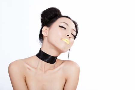 Young asian female with creative colorful makeupの写真素材