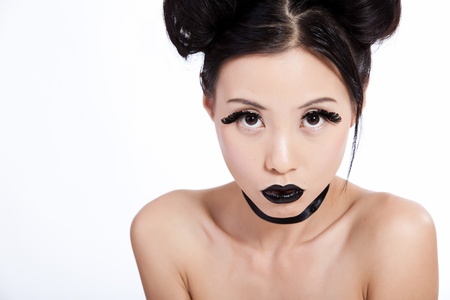 Young asian female with creative black makeup lookingの写真素材