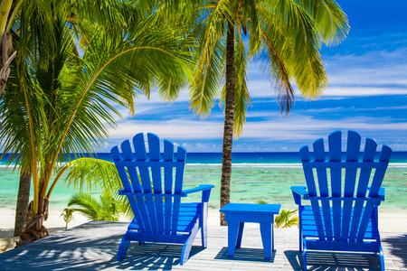 Two blue chairs on a beach front on amazing beach, Cook Islandsの写真素材