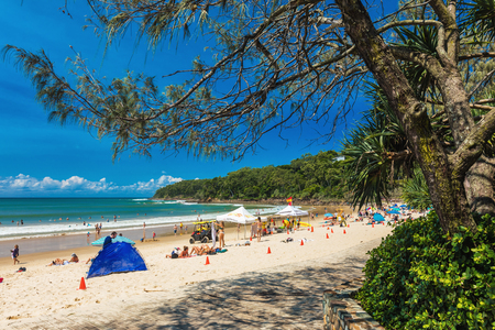 NOOSA, AUSTRALIA, FEB 17 2018: People enjoying summer at Noosa main beach - a famous tourist destination in Queensland, Australia.のeditorial素材