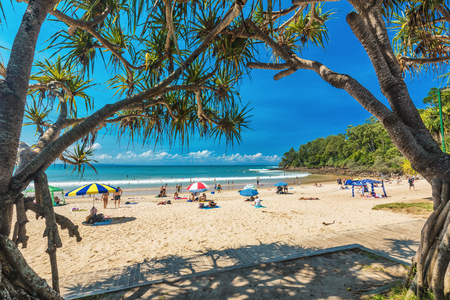 NOOSA, AUSTRALIA, FEB 17 2018: People enjoying summer at Noosa main beach - a famous tourist destination in Queensland, Australia.のeditorial素材