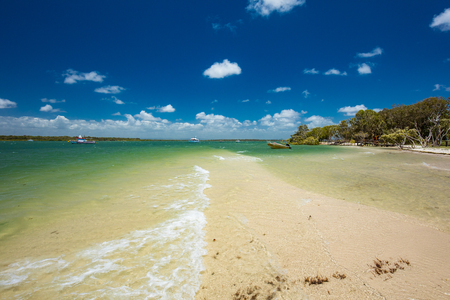 Summer tropical beach with trees on the east side of Bribie Island, Queensland, Australiaの写真素材
