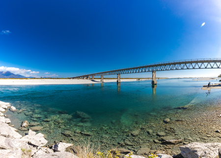 New Zealand's longest one-lane bridge over the Haast River, South Westlandの写真素材