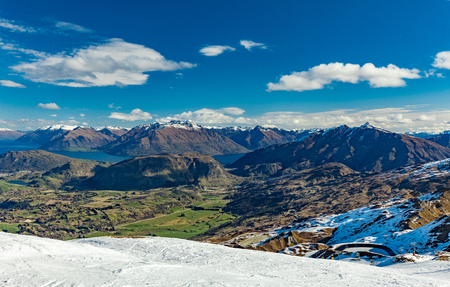 New Zealand mountain panorama and snow ski slopes as seen from Coronet Peak ski resort, Queenstownの写真素材
