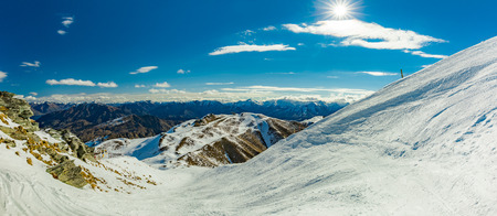 New Zealand mountain panorama and snow ski slopes as seen from Coronet Peak ski resort, Queenstownの写真素材