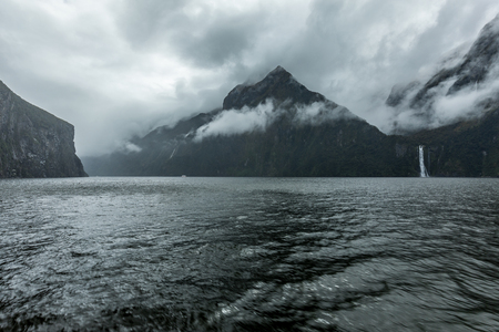 Cloudy and rainy day at amazing and vibrant Milford Sound, South Island, New Zealandの写真素材