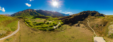 Rocky Mountain and Diamond Lake in the Mt Aspiring National Park near Wanaka, New Zealandの写真素材