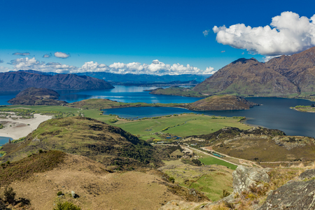 Rocky Mountain and Diamond Lake in the Mt Aspiring National Park near Wanaka, New Zealandの写真素材