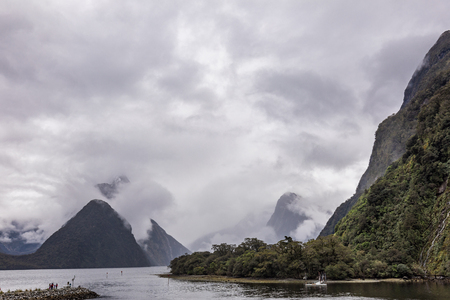 Cloudy and rainy day at amazing and vibrant Milford Sound, South Island, New Zealandの写真素材