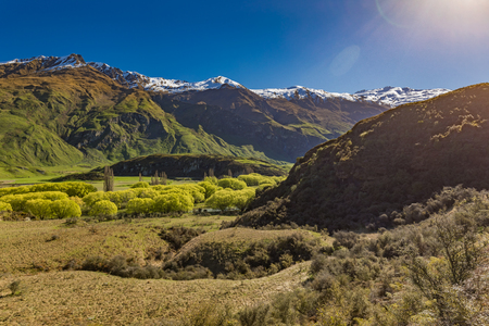 Rocky Mountain and Diamond Lake in the Mt Aspiring National Park near Wanaka, New Zealandの写真素材