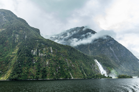 Cloudy and rainy day at amazing and vibrant Milford Sound, South Island, New Zealandの写真素材