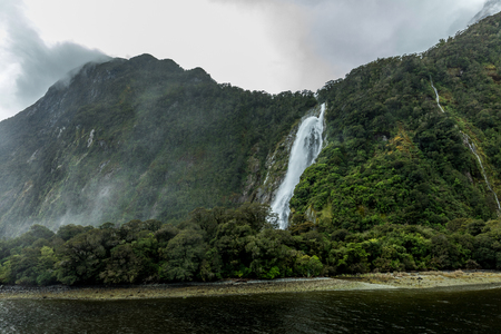 Cloudy and rainy day at amazing and vibrant Milford Sound, South Island, New Zealandの写真素材