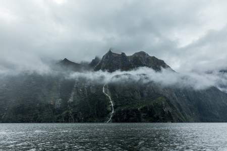 Cloudy and rainy day at amazing and vibrant Milford Sound, South Island, New Zealandの写真素材