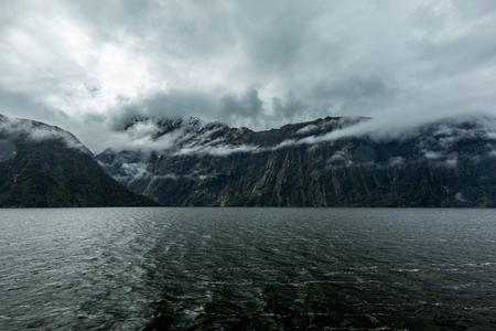 Cloudy and rainy day at amazing and vibrant Milford Sound, South Island, New Zealandの写真素材