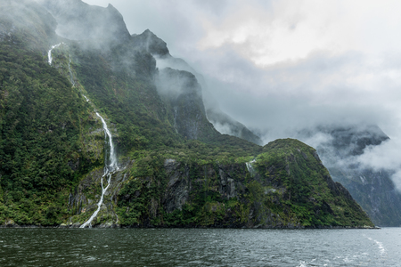 Cloudy and rainy day at amazing and vibrant Milford Sound, South Island, New Zealandの写真素材