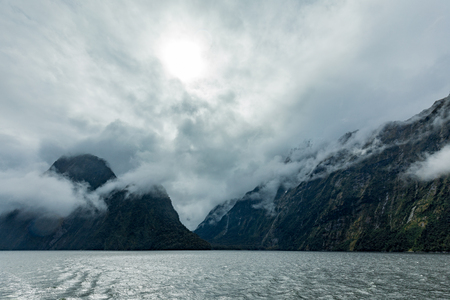 Cloudy and rainy day at amazing and vibrant Milford Sound, South Island, New Zealandの写真素材