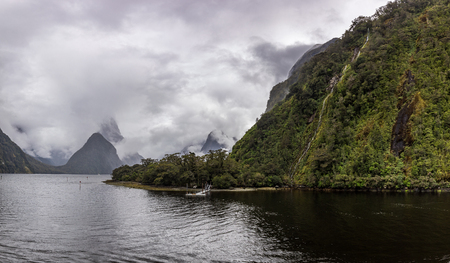 Cloudy and rainy day at amazing and vibrant Milford Sound, South Island, New Zealandの写真素材