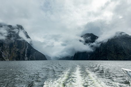 Cloudy and rainy day at amazing and vibrant Milford Sound, South Island, New Zealandの写真素材