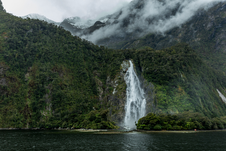 Cloudy and rainy day at amazing and vibrant Milford Sound, South Island, New Zealandの写真素材