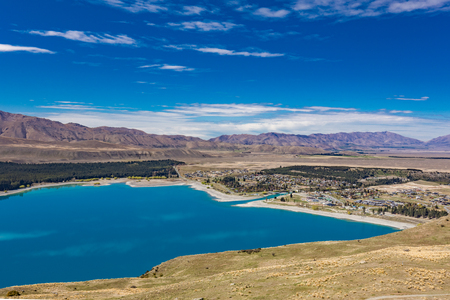 Beautiful Lake Tekapo with reflection of sky and mountains, New Zealandの写真素材