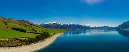 Panoramic vibrant photos of Lake Hawea and mountains, South Island, New Zealandの写真素材