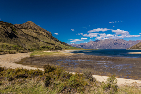 Panoramic vibrant photos of Lake Hawea and mountains, South Island, New Zealandの写真素材