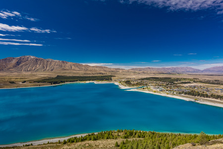 Beautiful Lake Tekapo with reflection of sky and mountains, New Zealandの写真素材