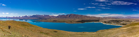 Beautiful Lake Tekapo with reflection of sky and mountains, New Zealandの写真素材