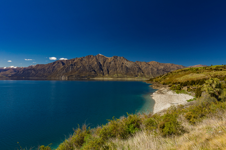 Panoramic vibrant photos of Lake Hawea and mountains, South Island, New Zealandの写真素材