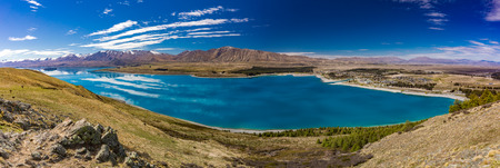 Beautiful Lake Tekapo with reflection of sky and mountains, New Zealandの写真素材
