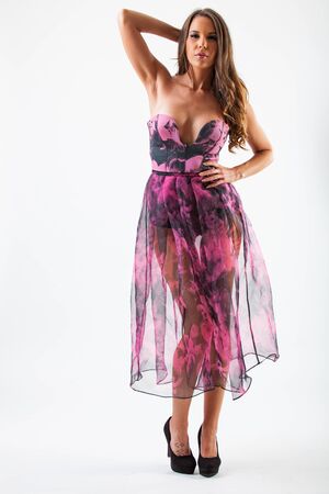 Fashion photo of young beautiful lady in elegant purple party dressの写真素材