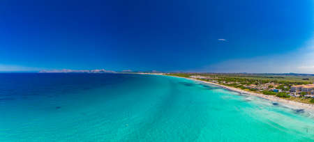 Aerial drone view of a coast line with beach in playa de Muro, Mallorca, Spainの写真素材