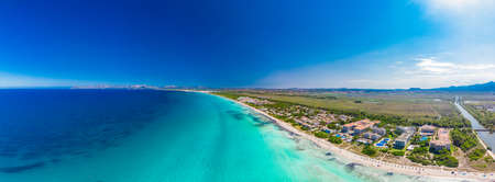 Aerial drone view of a coast line with beach in playa de Muro, Mallorca, Spainの写真素材