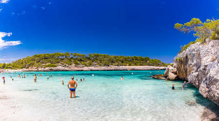 CALA MONDRAGO, Majorka, Spain, 24 July 2020 - People enjoy famous beach in summer, Parque Natural de Mondrago. Santanyi. Malorca. Spainのeditorial素材
