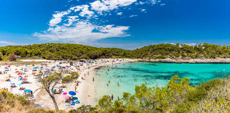 CALA MONDRAGO, Majorka, Spain, 24 July 2020 - People enjoy famous beach in summer, Parque Natural de Mondrago. Santanyi. Malorca. Spainのeditorial素材