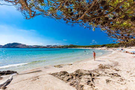 CALA AGULLA, MALLORCA, SPAIN - 21 July 2020: People enjoying summer on the popular sand beach on Mallorca,  Balearic Islands.のeditorial素材
