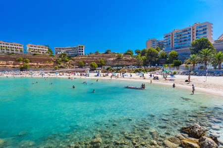 PORT ADRIANO, MALLORCA, SPAIN - 23 July 2020 - Tourists enjoying summer day on the popular city beach.のeditorial素材