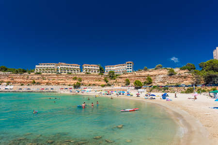 PORT ADRIANO, MALLORCA, SPAIN - 23 July 2020 - Tourists enjoying summer day on the popular city beach.のeditorial素材