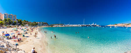 PORT ADRIANO, MALLORCA, SPAIN - 23 July 2020 - Tourists enjoying summer day on the popular city beach.のeditorial素材