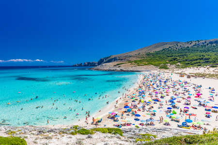 CALA MESQUIDA, MALLORCA, SPAIN - 19 July 2020: People enjoying beautiful sandy beach of on Mallorca, Mediterranean Sea, Balearic islands, Spain.のeditorial素材
