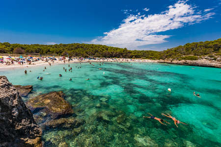 CALA MONDRAGO, Majorka, Spain, 24 July 2020 - People enjoy famous beach in summer, Parque Natural de Mondrago. Santanyi. Malorca. Spainのeditorial素材