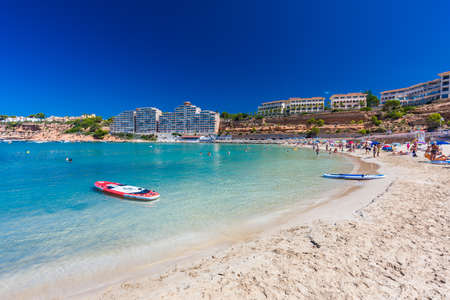 PORT ADRIANO, MALLORCA, SPAIN - 23 July 2020 - Tourists enjoying summer day on the popular city beach.のeditorial素材