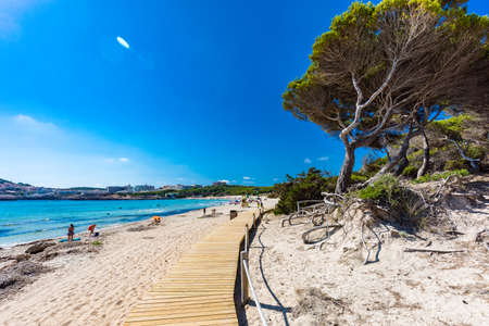 CALA AGULLA, MALLORCA, SPAIN - 21 July 2020: People enjoying summer on the popular sand beach on Mallorca,  Balearic Islands.のeditorial素材