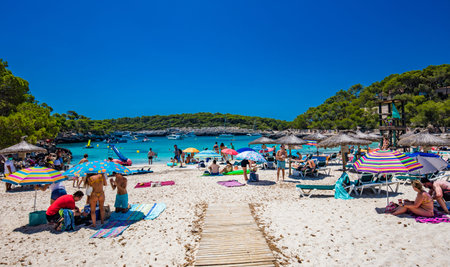 CALA MONDRAGO, Majorka, Spain, 24 July 2020 - People enjoy famous beach in summer, Parque Natural de...