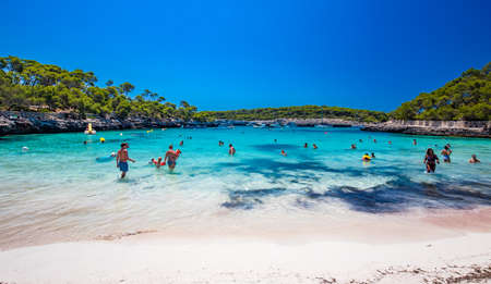 CALA MONDRAGO, Majorka, Spain, 24 July 2020 - People enjoy famous beach in summer, Parque Natural de Mondrago. Santanyi. Malorca. Spainのeditorial素材