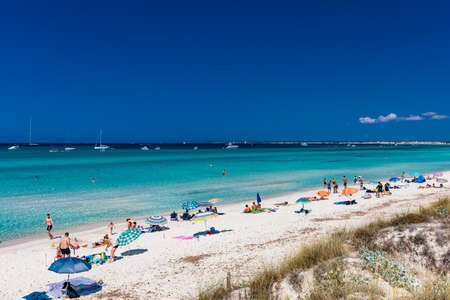 ES TRENC, Majorca, Spain - 25 JULY 2020 - People enjoying summer day on tourist hotspot beach in Majorka.のeditorial素材
